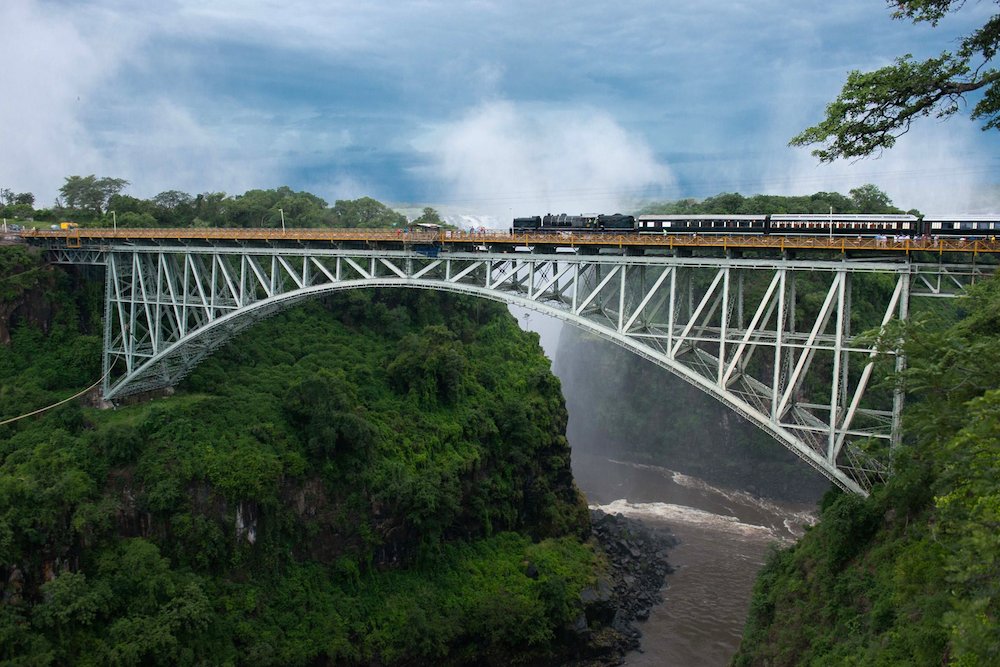Train over Victoria Falls Bridge Zambezi river