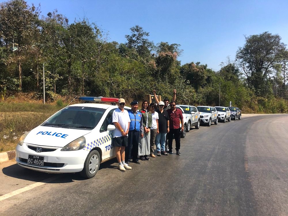 Tourists with policeman in Myanmar