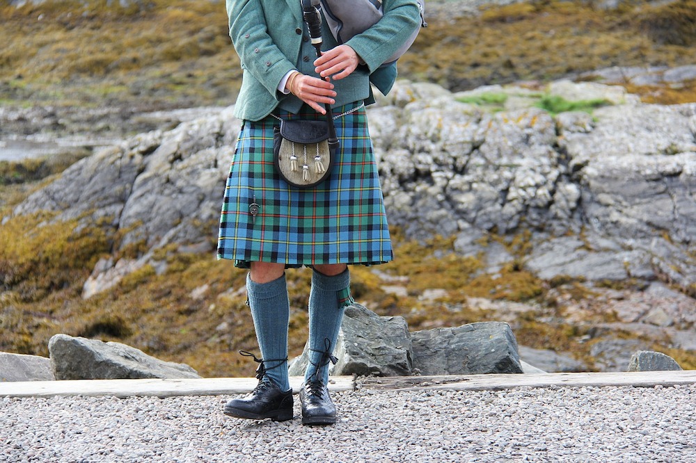 Scottish kilt and bagpiper