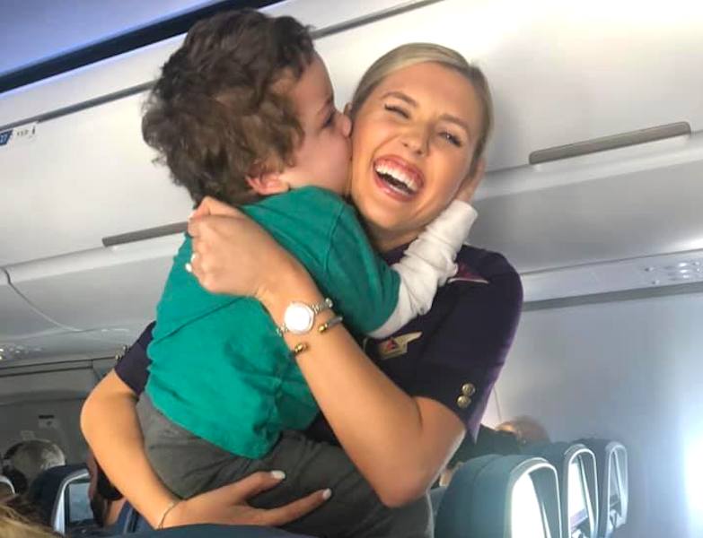 Autistic child with Delta flight attendant